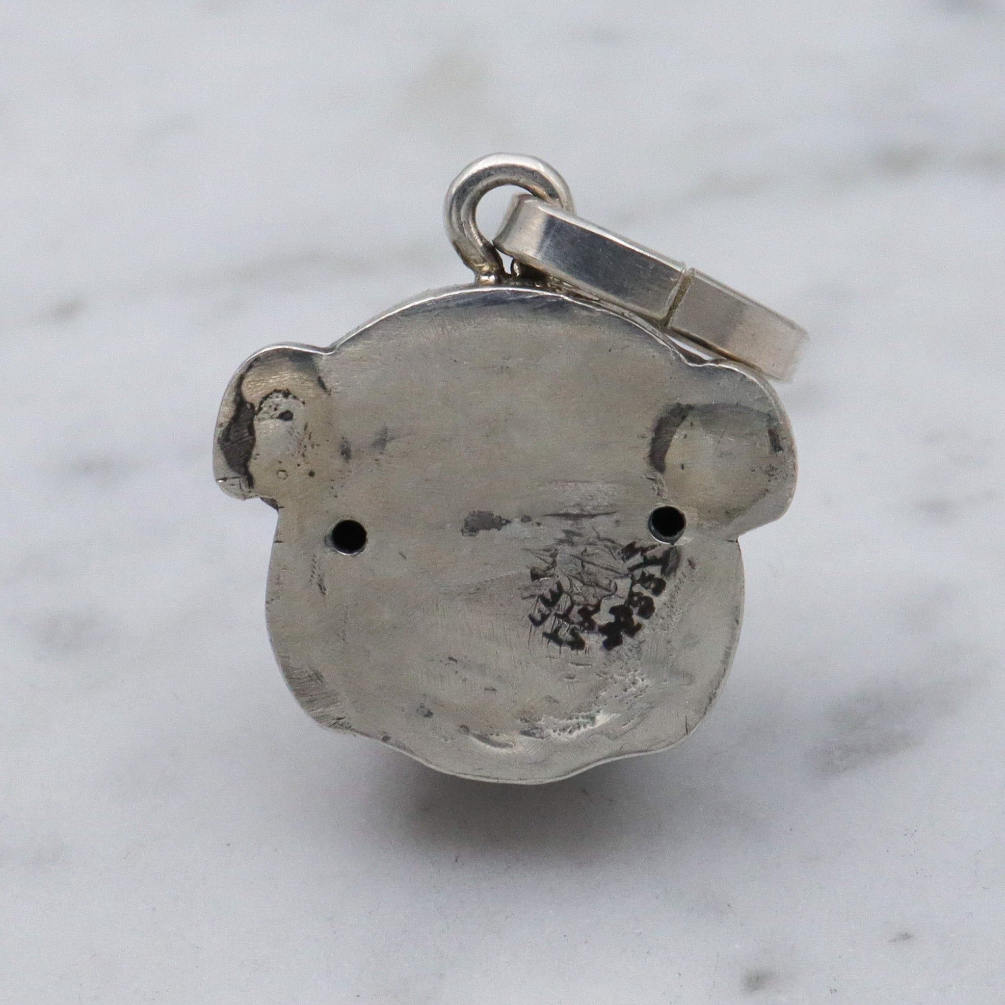 Antique Unger Brothers sterling silver bulldog with ruby glass eyes pendant